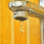 Illustration of common home plumbing problems like leaks and clogs in Suffolk County